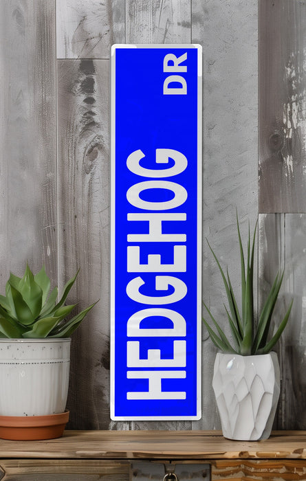 a blue sign sitting on top of a wooden shelf