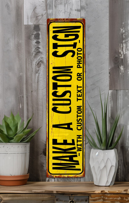 a yellow sign sitting on top of a wooden shelf