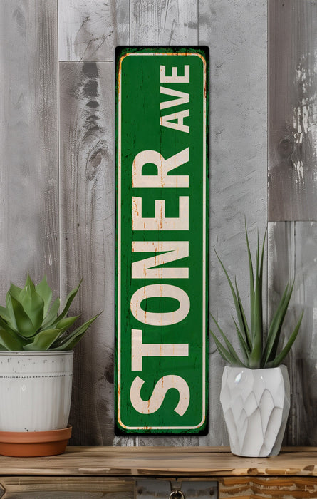 a green sign sitting on top of a wooden shelf