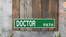 a green and white sign that reads doctor path