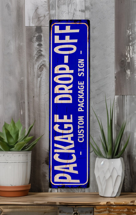 a blue sign sitting on top of a wooden shelf