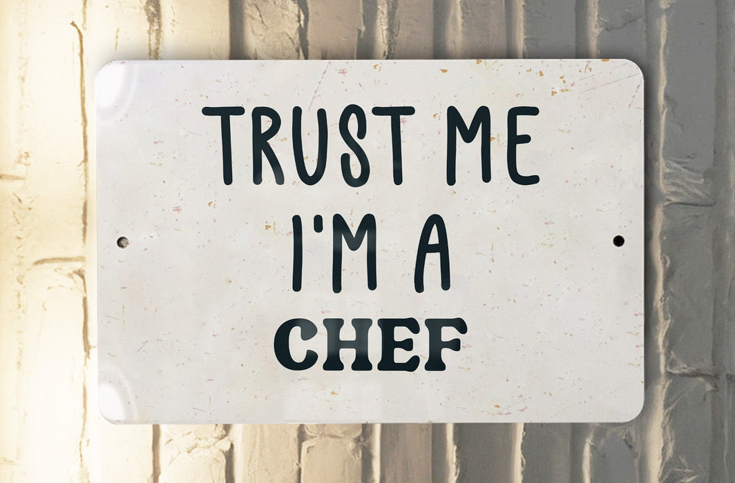 a white sign that says trust me i'm a chef