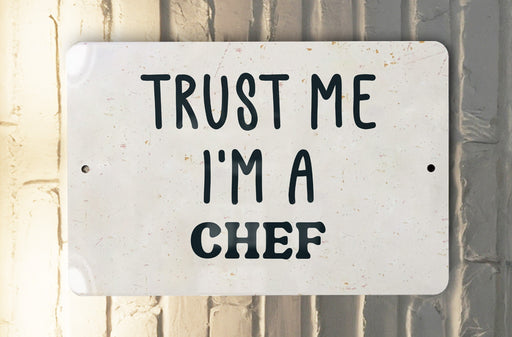 a white sign that says trust me i'm a chef