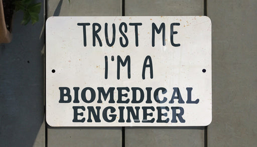 a sign that says trust me i'm a biomedical engineer