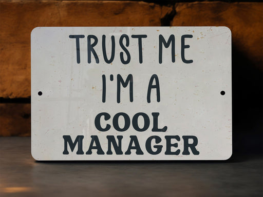 a sign that says trust me i'm a cool manager