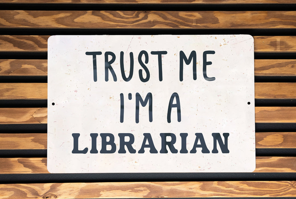 a sign that says trust me i'm a librarian