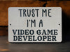 a sign that says trust me i'm a video game developmenter