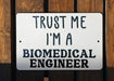 a sign that says trust me i'm a biomedical engineer