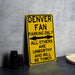 a yellow sign sitting on top of a table