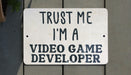 a sign that says trust me i'm a video game developer