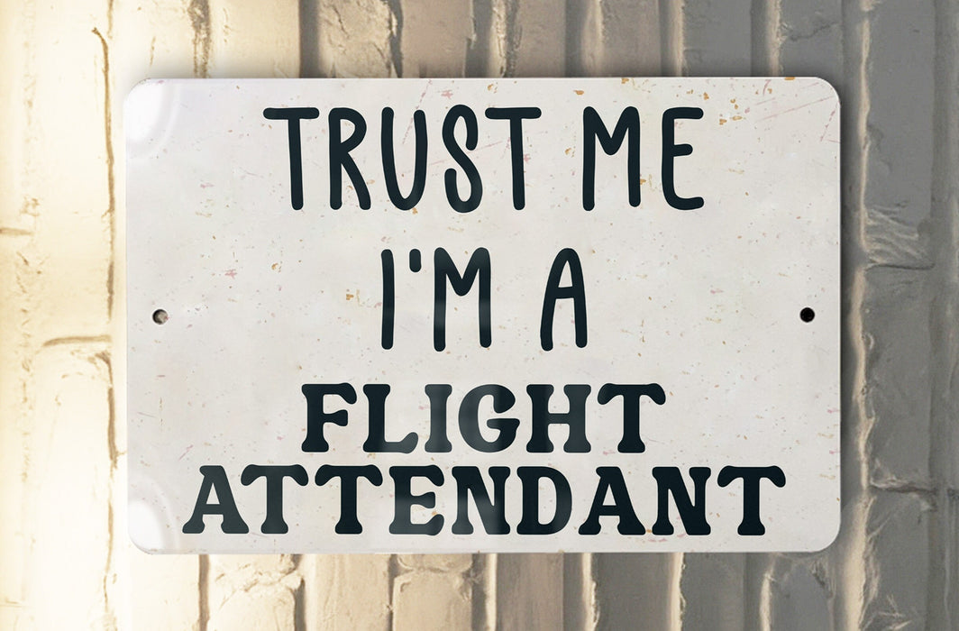 a white sign that says trust me i'm a flight attendant