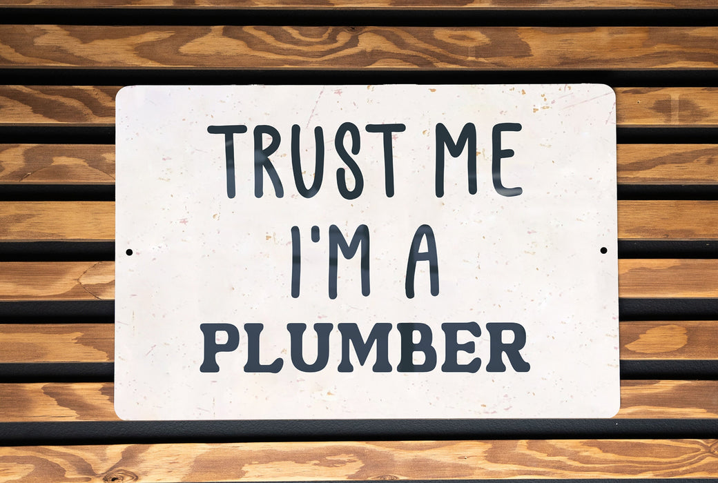 a sign that says trust me i'm a plumber