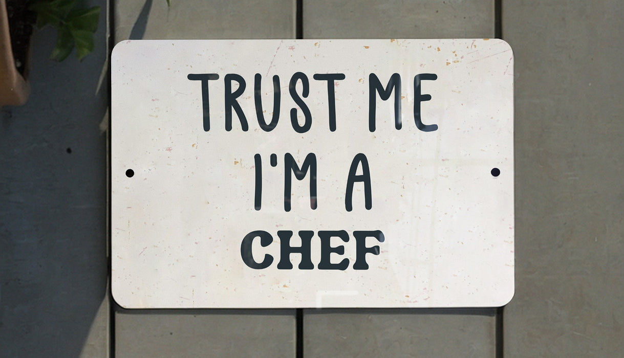 a white sign that says trust me i'm a chef
