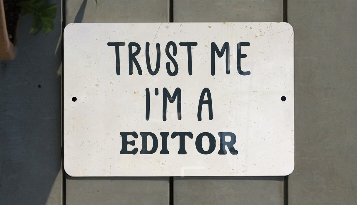 a white sign that says trust me i'm a editor
