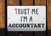 a white sign that says trust me i'm a accountant