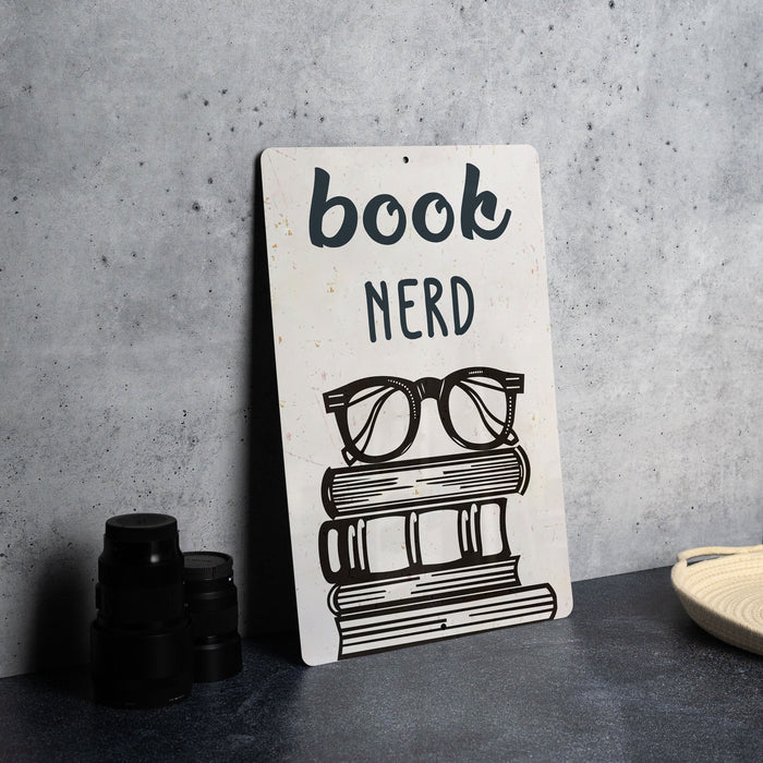 a sign that reads book nerd next to a pair of glasses