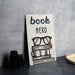 a sign that reads book nerd next to a pair of glasses