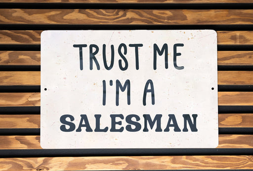 a sign that says trust me i'm a salesman