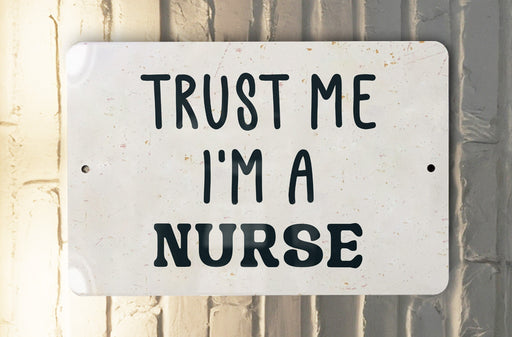a white sign that says trust me i'm a nurse