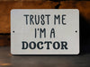 a sign that says trust me i'm a doctor