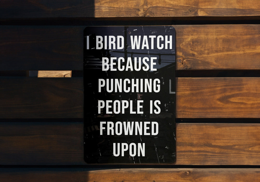 a sign on a wooden bench that says, i bird watch because punching people is