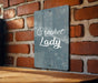 a sign that reads crochet lady on a brick wall