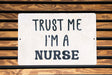 a sign that says trust me i'm a nurse