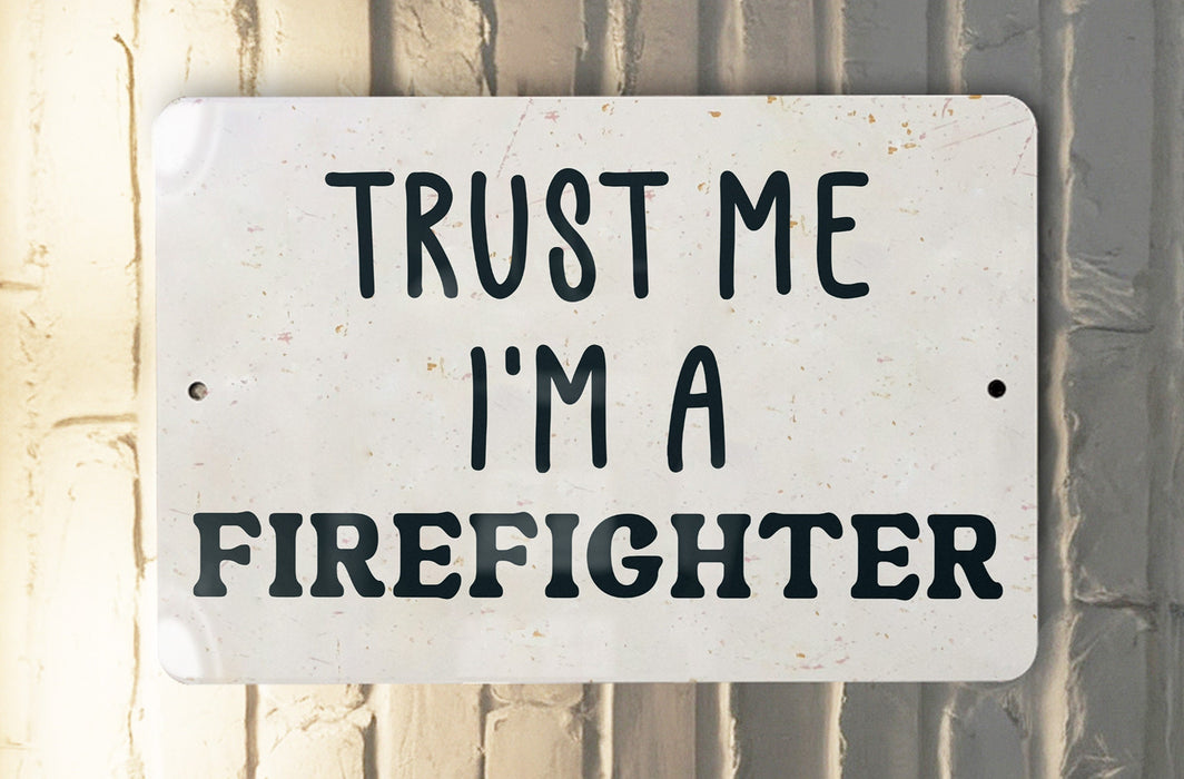 a white sign that says trust me i'm a firefighter