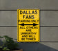 a yellow sign that says, dallas fans parking only all others are unworthyly