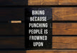 a sign that is on a wooden bench
