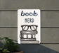 a sign that says book nerd with glasses on it