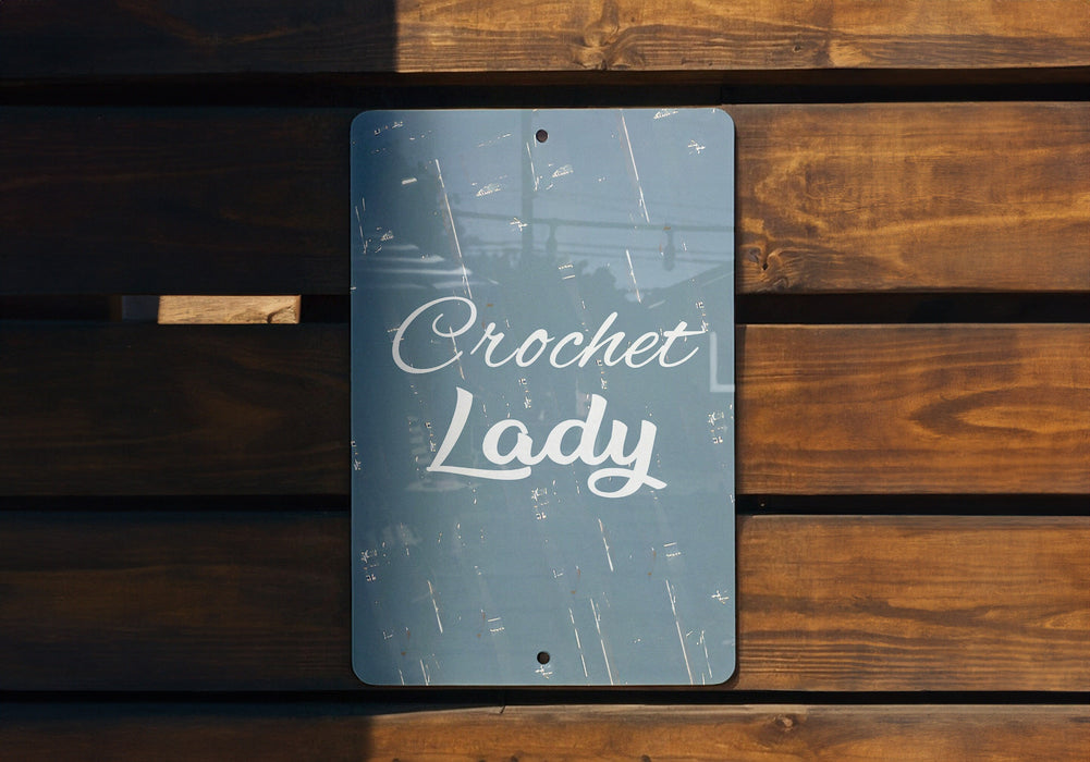a sign that reads crochet lady on a wooden bench