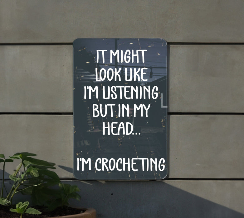 a sign that says it might look like i'm listening but in my head