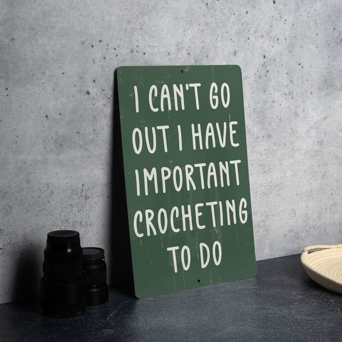 a sign that says i can't go out i have important crocheting