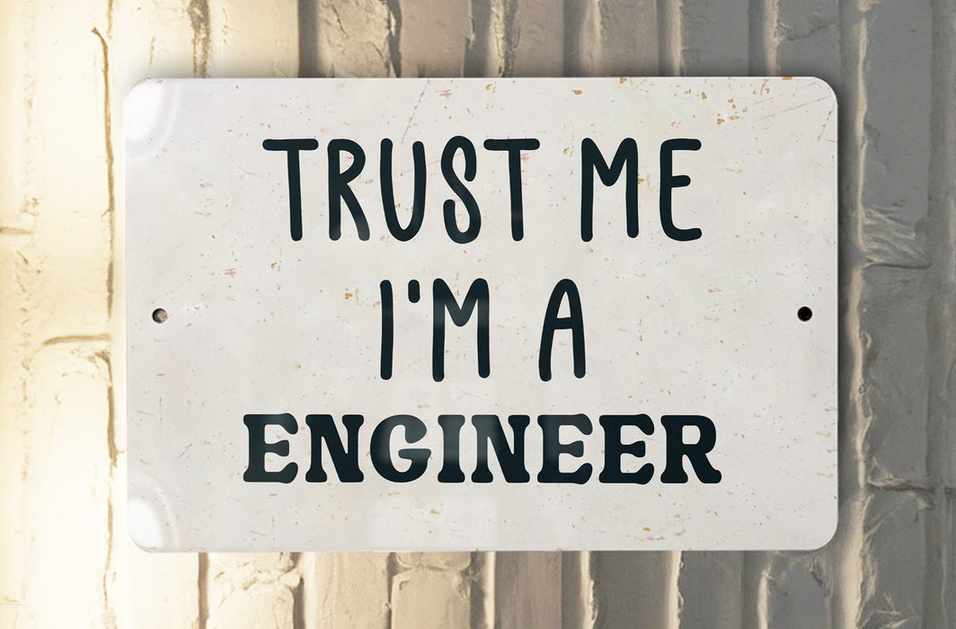 a white sign that says trust me i'm a engineer