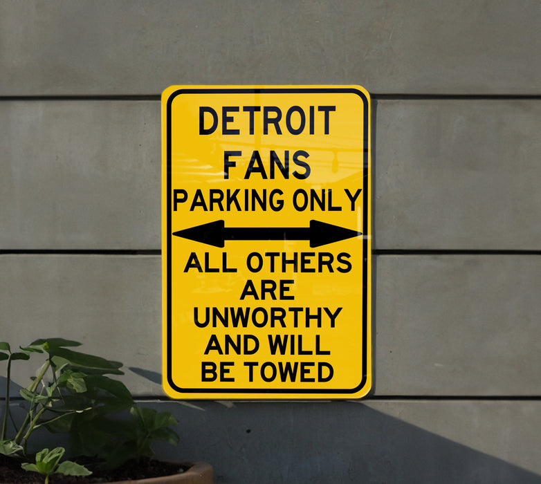 a yellow street sign on the side of a building