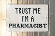 a sign that says trust me i'm a pharmacist