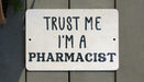 a sign that says trust me i'm a pharmacist