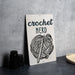 a sign that says crochet nerd with a ball of yarn