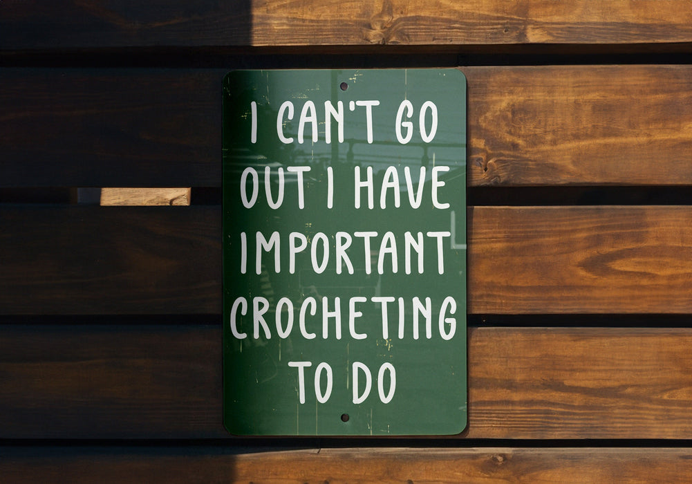 a green sign that says i can't go out i have important croche