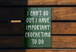 a green sign that says i can't go out i have important croche