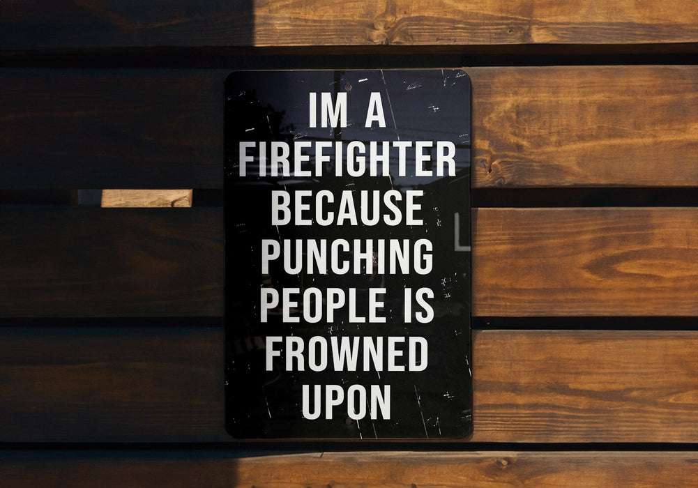 a sign on a wooden bench that says i'm a firefighter because punching