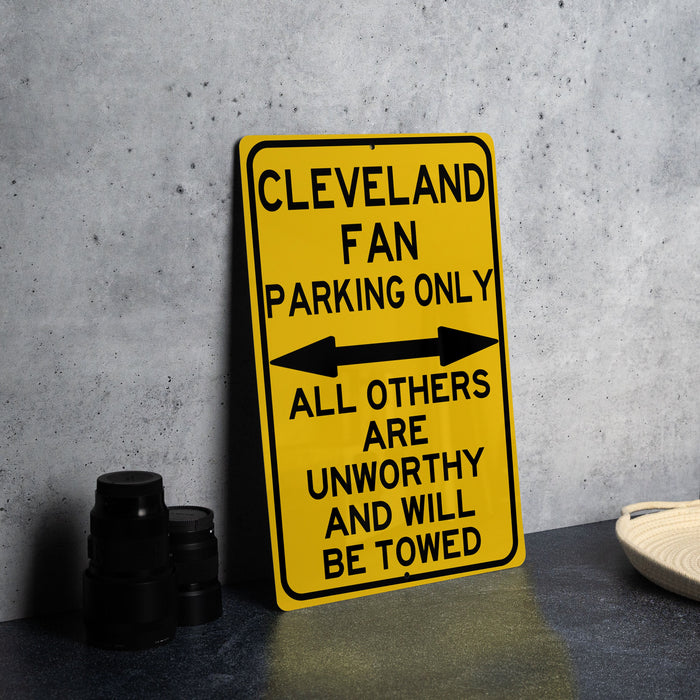 a yellow and black sign sitting on top of a table