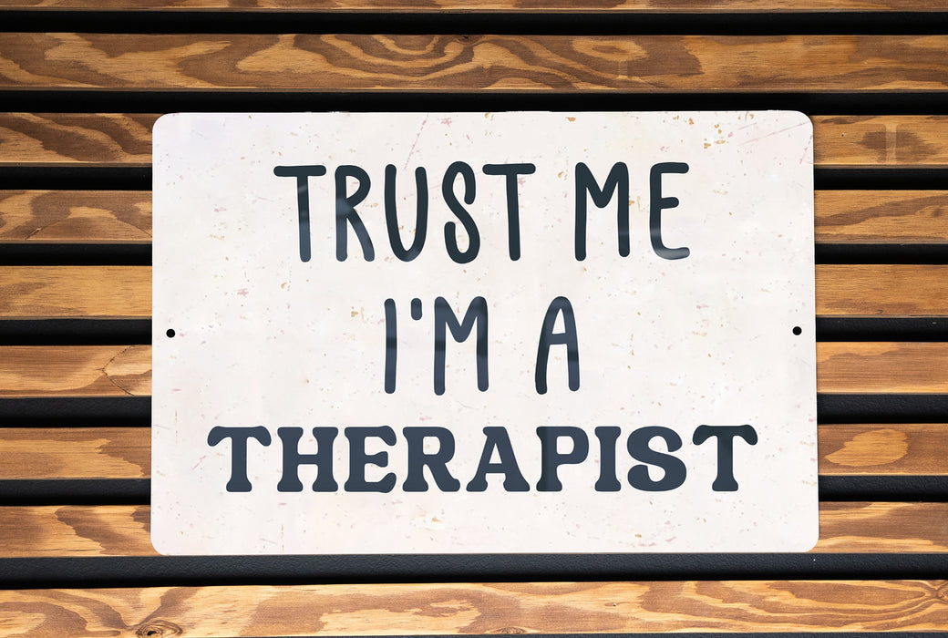 a sign that says trust me i'm a therapist