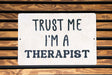a sign that says trust me i'm a therapist