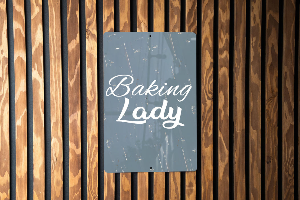 a sign that says baking lady on a wooden wall