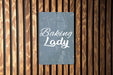 a sign that says baking lady on a wooden wall