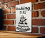 a sign on a brick wall that says baking nerd