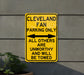 a yellow parking only sign on the side of a building