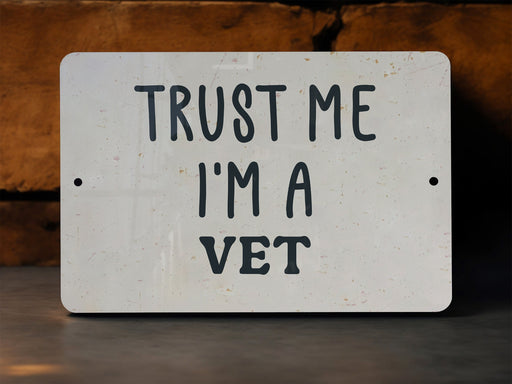 a white sign that says trust me i'm a vet